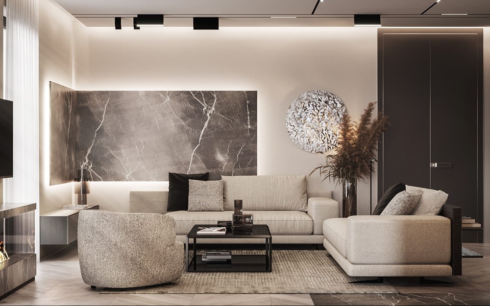 A renovated open-plan living room with a marble feature wall, sectional sofa and warm lighting